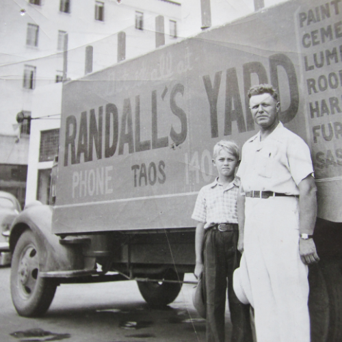 An old image of Randall Lumber & Hardware employees in front of a branded box truck
