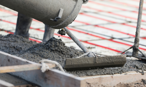 Concrete being poured and leveled