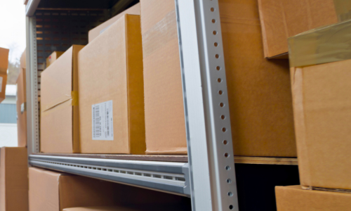 Cardboard boxes stacked on racks