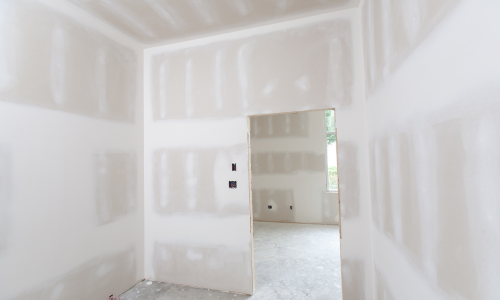 The interior of a building drywalled and spackled 